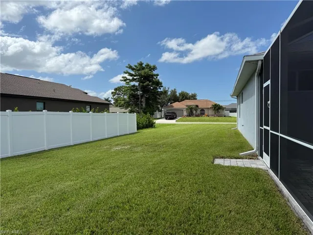 View of yard featuring a lanai