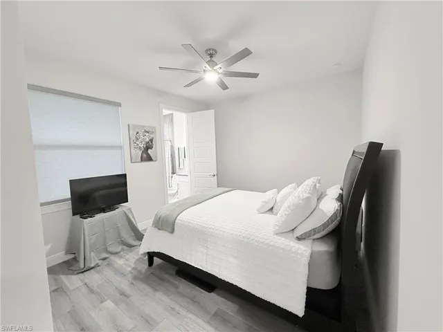 Bedroom featuring wood finished floors and ceiling fan