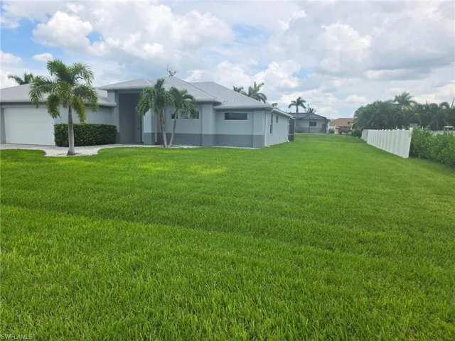 View of yard featuring an attached garage