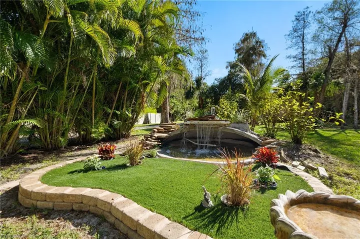 View of home's community featuring a yard