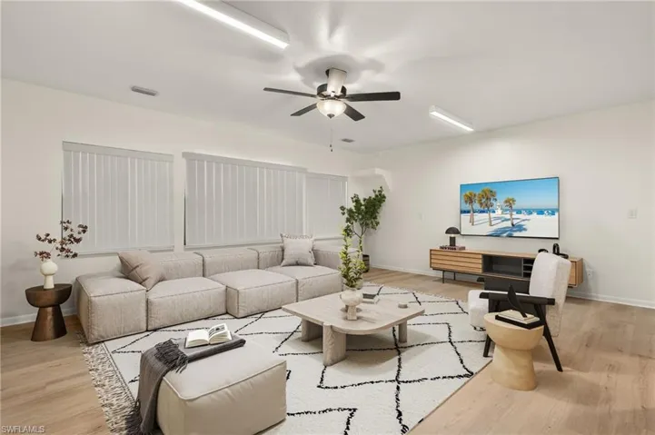 Virtual Staging Family Room featuring ceiling fan and light hardwood / wood-style floors