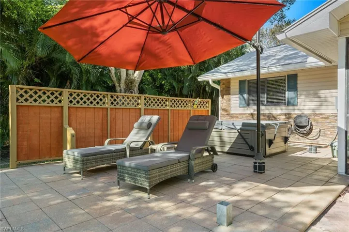 View of patio / terrace with a hot tub