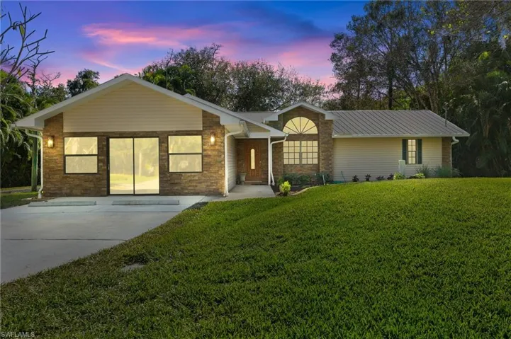 Dusk Conversion Single story home with a yard