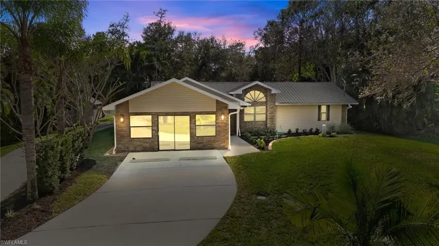 Dusk Conversion Ranch-style house with a yard