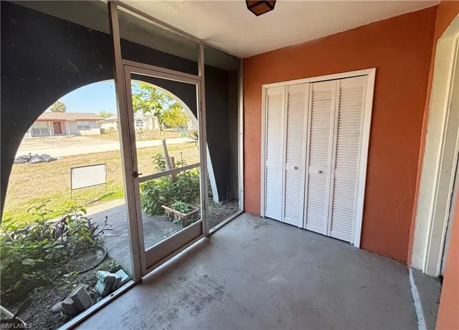 Doorway featuring unfinished concrete floors