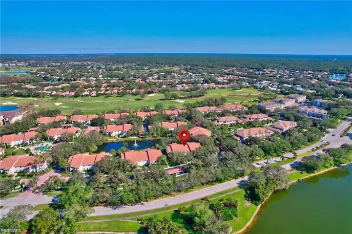 View of property location with a nearby body of water and nearby suburban area