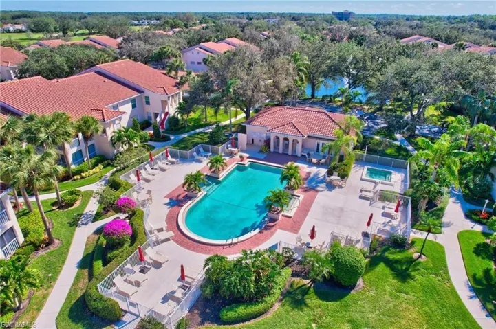 Aerial perspective of suburban area with a pool