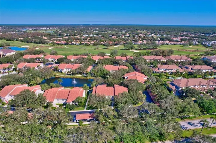 Aerial overview of property's location featuring a large body of water and nearby suburban area