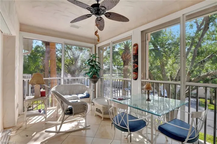 Sunroom / solarium with tile patterned floors
