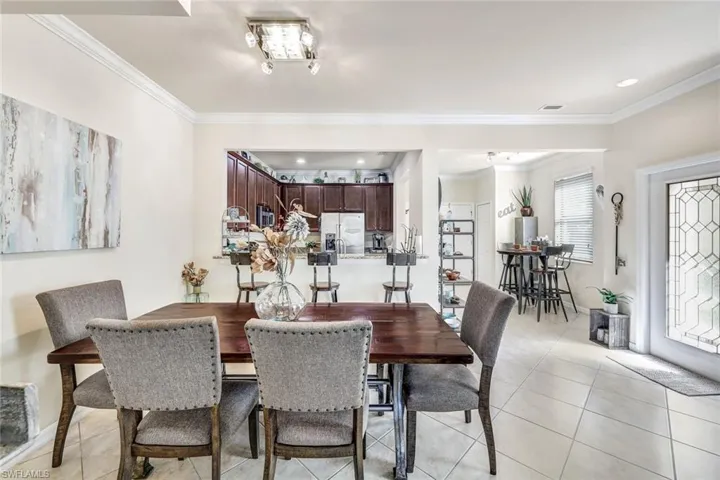 Kitchen and casual dining area to the right, larger dining area and great room to the left of the entry door.