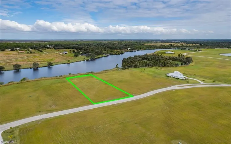 View of property location featuring a nearby body of water and property boundaries highlighted
