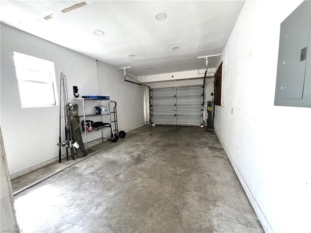 Garage with electric panel and electric water heater