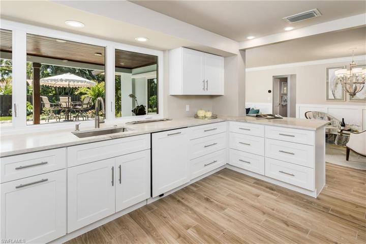 This is a HUGE kitchen, looking over the pool and back yard!!