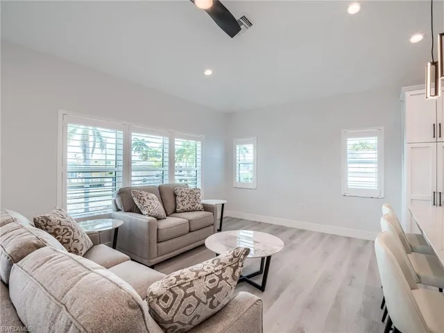 Living room featuring a healthy amount of sunlight and light hardwood / wood-style flooring