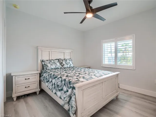 Bedroom with light wood-type flooring and ceiling fan