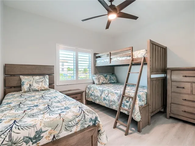 Bedroom featuring ceiling fan and light hardwood / wood-style floors