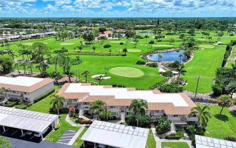 Aerial view featuring golf course view, canal view, and a residential view