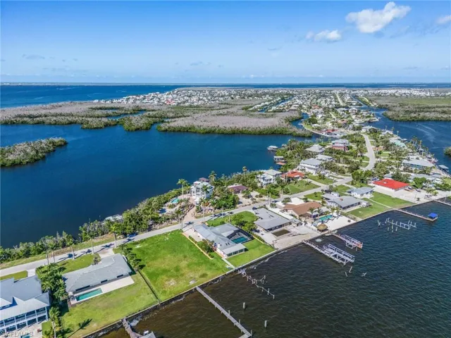 Aerial of home looking West to San Carlos Bay, Sanibel and Captiva, with the Gulf of Mexico in the background!