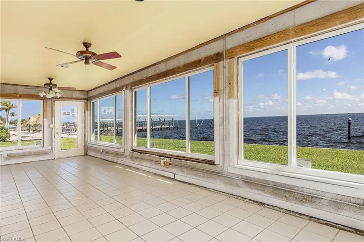 This sunroom has all new hurricane windows (to be completed soon) to enjoy the bayviews.