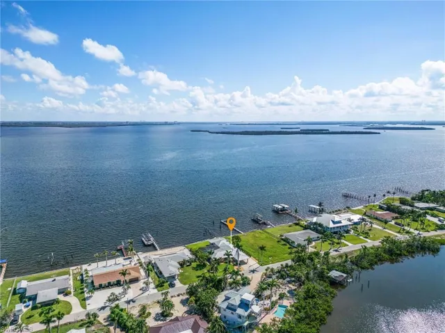 Aerial view of the home with Matlacha Pass, and only minutes to the Caloosahatchee River (ICW), and the Gulf of Mexico, Ft. Myers Beach, Sanibel, and Captiva.