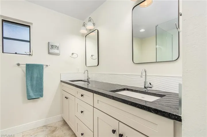 Master Bath has dual sinks with granite counters.