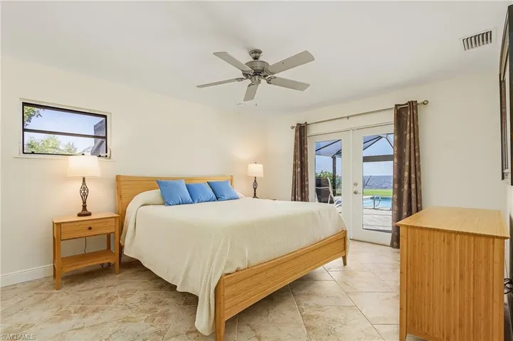 Master Bedroom with French Doors leading to lanai and pool.