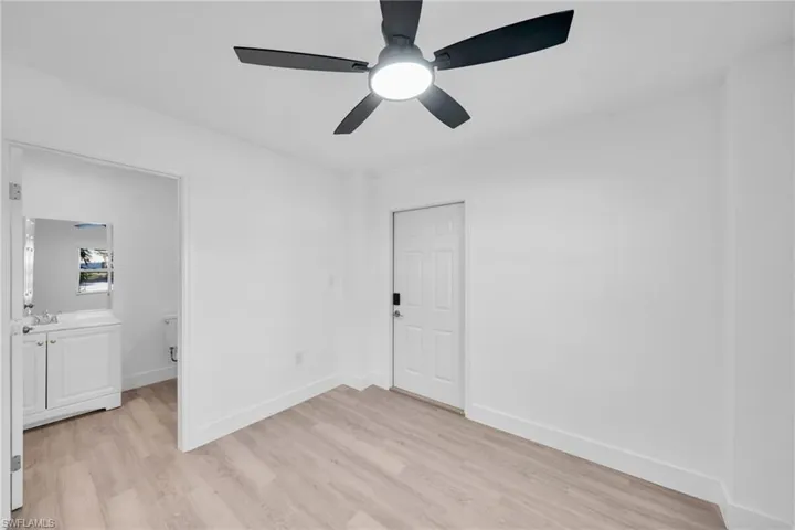 Unfurnished bedroom featuring light wood-type flooring and ceiling fan