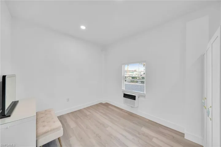 Unfurnished room with light wood-style flooring and recessed lighting