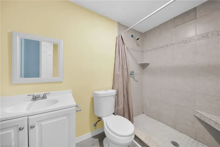 Bathroom featuring vanity and a stall shower