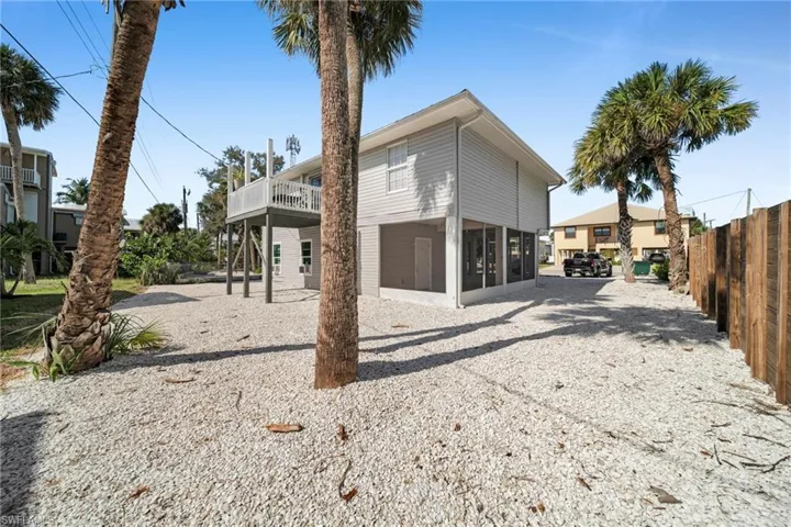 Back of house with a wooden deck