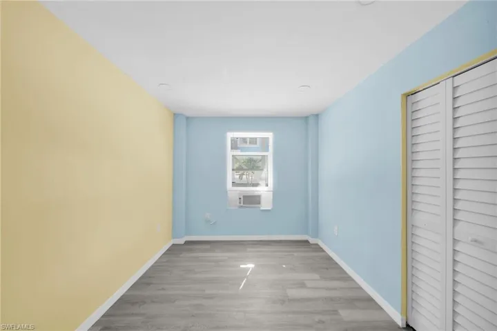 Unfurnished bedroom with a closet and light wood finished floors