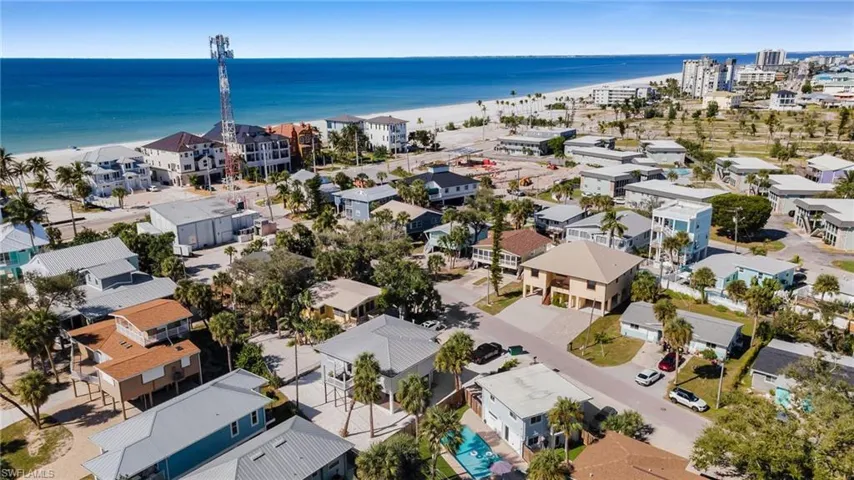 Aerial view of residential area with expansive beach