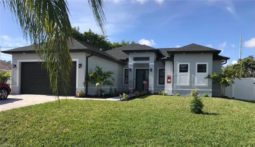 View of front of home featuring stucco siding, an attached garage, driveway, and roof with shingles