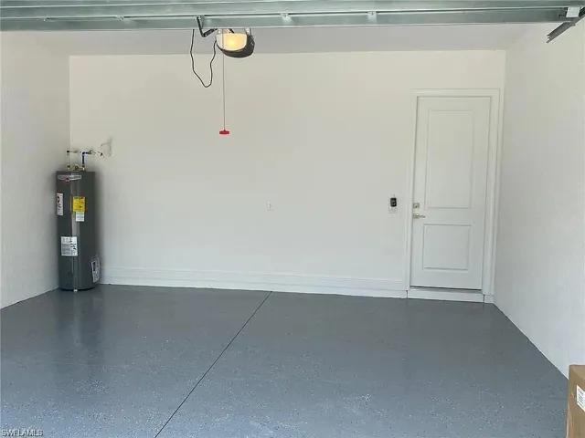 Garage featuring water heater