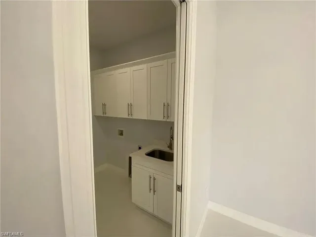 Laundry room with cabinet space and hookup for a washing machine