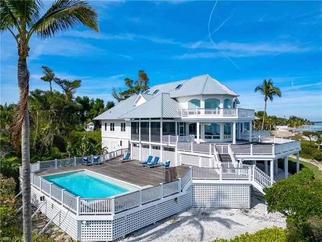 Rear view of house featuring a pool