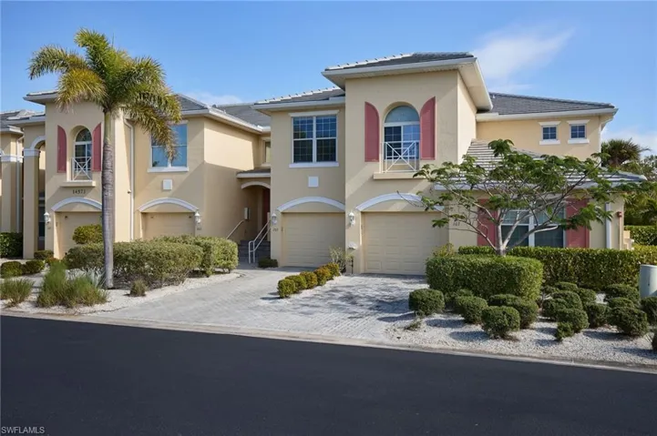 Mediterranean / spanish house featuring an attached garage, decorative driveway, and stucco siding