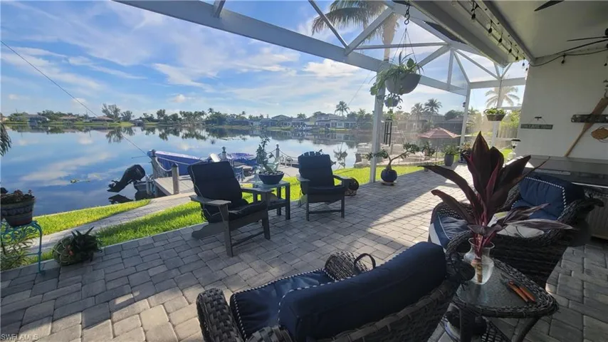 View of patio / terrace featuring a water view and a dock