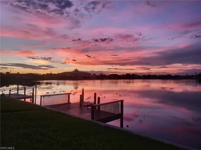 Dock area featuring a water view