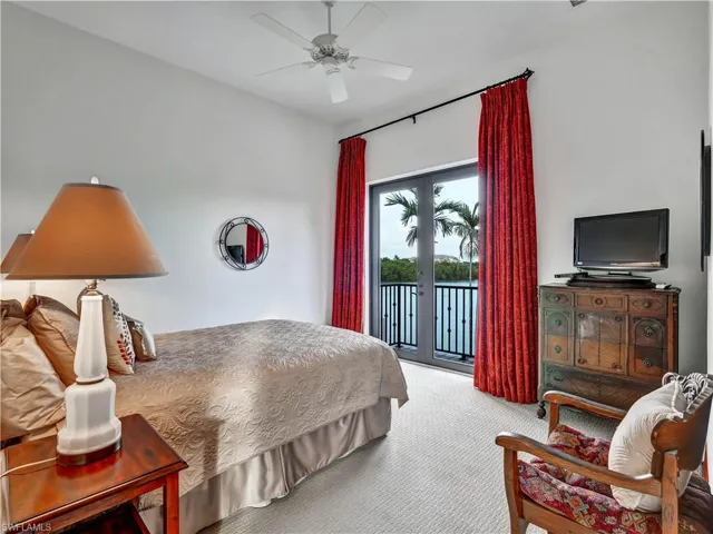 French doors opening to a balcony with water scenery