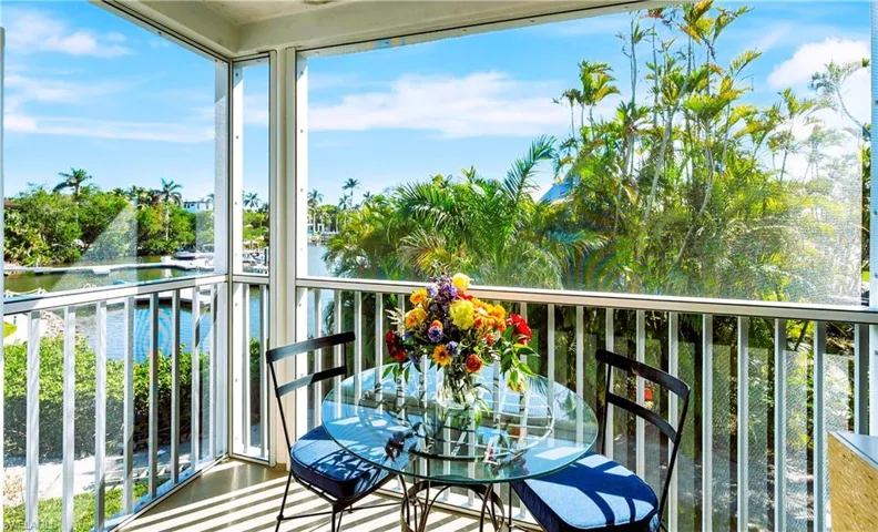 Lanai off off of the primary bedroom with a water view