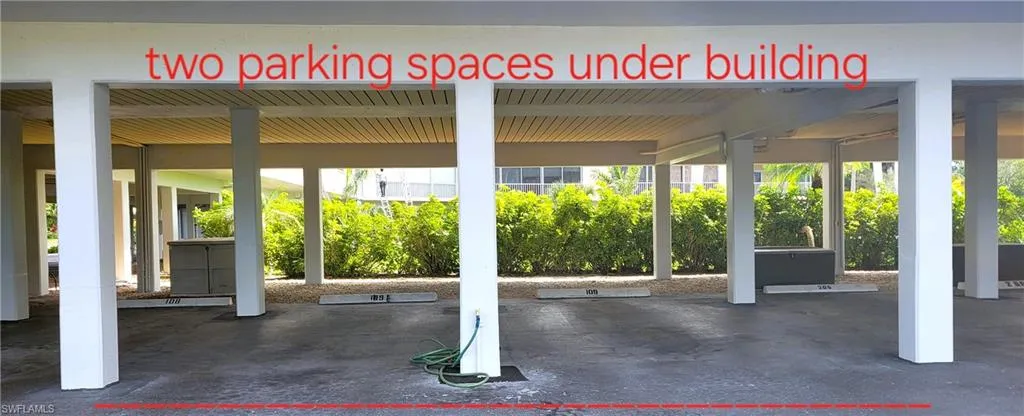 Under building carport with two assigned spaces and vehicle wash