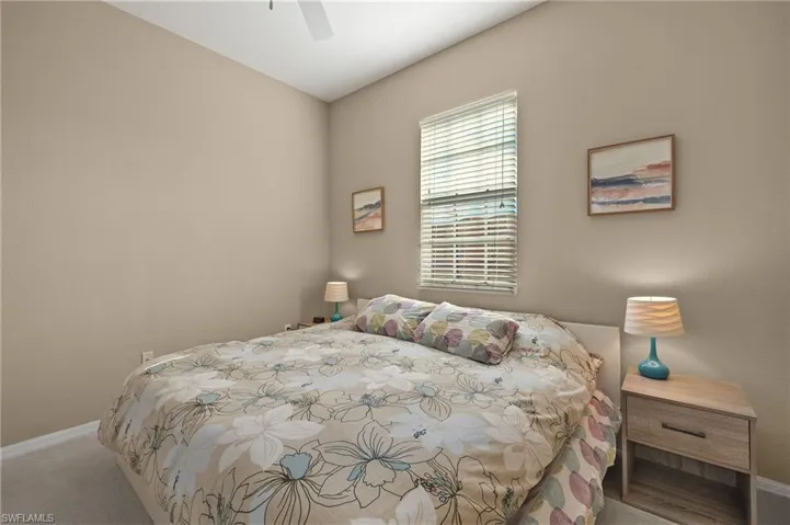 Bedroom featuring carpet and ceiling fan