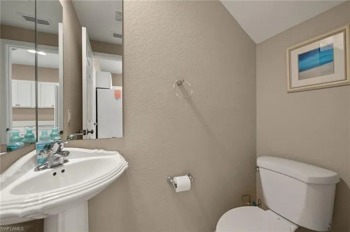 Bathroom featuring sink and toilet