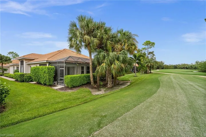 View of home's community featuring a lawn and a sunroom