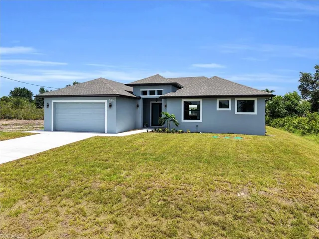 Contemporary-style exterior with a light blue stucco finish