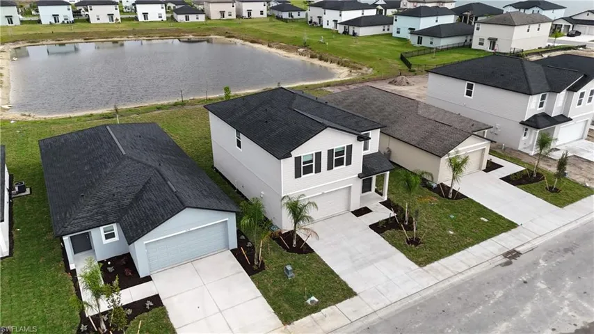 Aerial perspective of suburban area with a large body of water