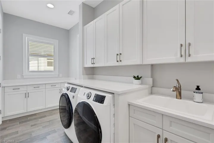 Laundry room with sink and kitchen prep area