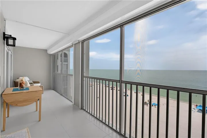 Spacious tiled balcony with new electric storm shutters.