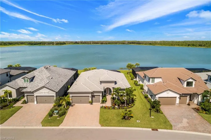 Birds eye view of property with a western exposure, water view